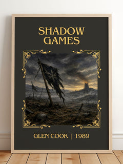 Shadow Games Classic Book Art Print by Glen Cook – framed print leaning on a wooden floor