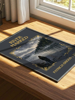 River Marked Classic Book Art Print by Patricia Briggs – print on a sunlit desk