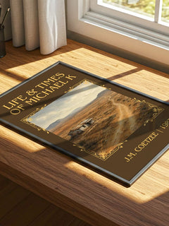 Life & Times of Michael K Classic Book Art Print by J.M. Coetzee – print on a sunlit desk