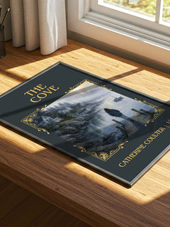 The Cove Classic Book Art Print by Catherine Coulter – print on a sunlit desk