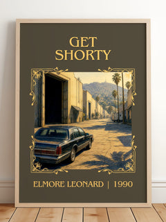 Get Shorty Classic Book Art Print by Elmore Leonard – framed print leaning on a wooden floor