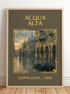 Acqua Alta Classic Book Art Print by Donna Leon – framed print leaning on a wooden floor