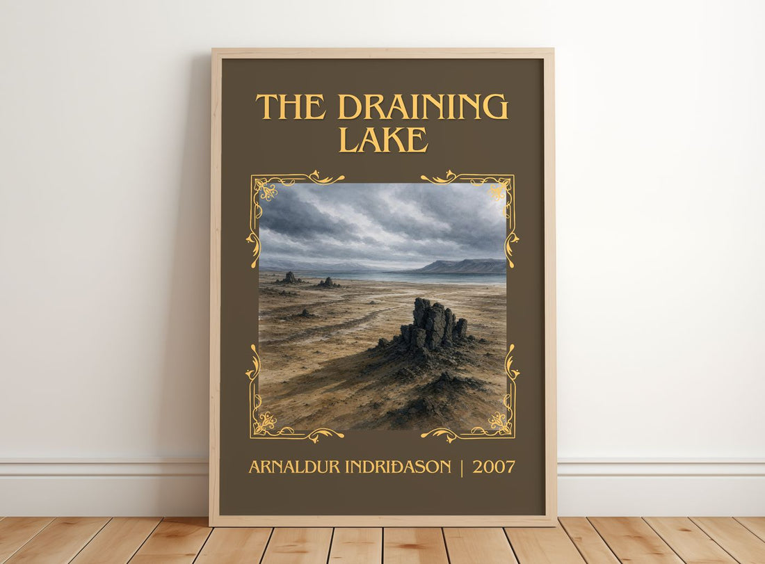 The Draining Lake Classic Book Art Print by Arnaldur Indriðason – framed print leaning on a wooden floor