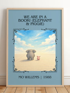 We Are in a Book! (Elephant & Piggie) Classic Book Art Print by Mo Willems – framed print leaning on a wooden floor