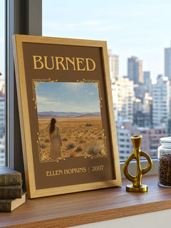 Burned Classic Book Art Print by Ellen Hopkins – framed print on a city-view windowsill