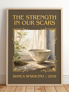 The Strength in Our Scars Classic Book Art Print by Bianca Sparacino – framed print leaning on a wooden floor