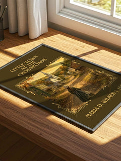 Little Town at the Crossroads Classic Book Art Print by M. Wilkes – print on a sunlit desk