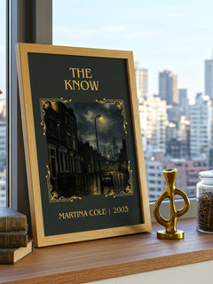 The Know Classic Book Art Print by Martina Cole – framed print on a city-view windowsill