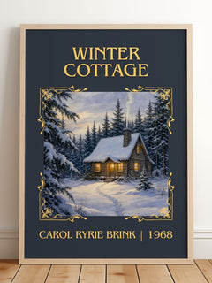 Winter Cottage Classic Book Art Print by Carol Ryrie Brink – framed print leaning on a wooden floor