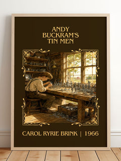 Andy Buckram's Tin Men Classic Book Art Print by Carol Ryrie Brink – framed print leaning on a wooden floor