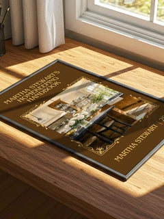Martha Stewart's Homekeeping Handbook Classic Book Art Print by Martha Stewart – print on a sunlit desk