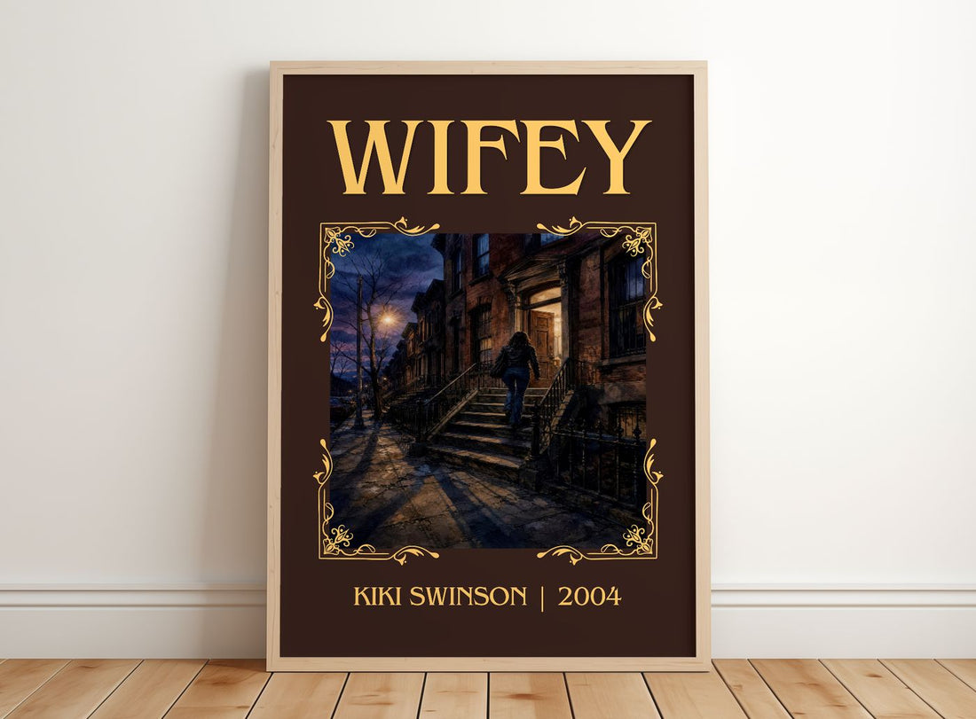 Wifey Classic Book Art Print by Kiki Swinson – framed print leaning on a wooden floor