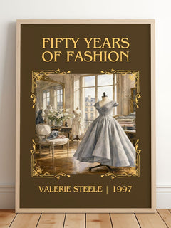 Fifty years of fashion Classic Book Art Print by Valerie Steele – framed print leaning on a wooden floor