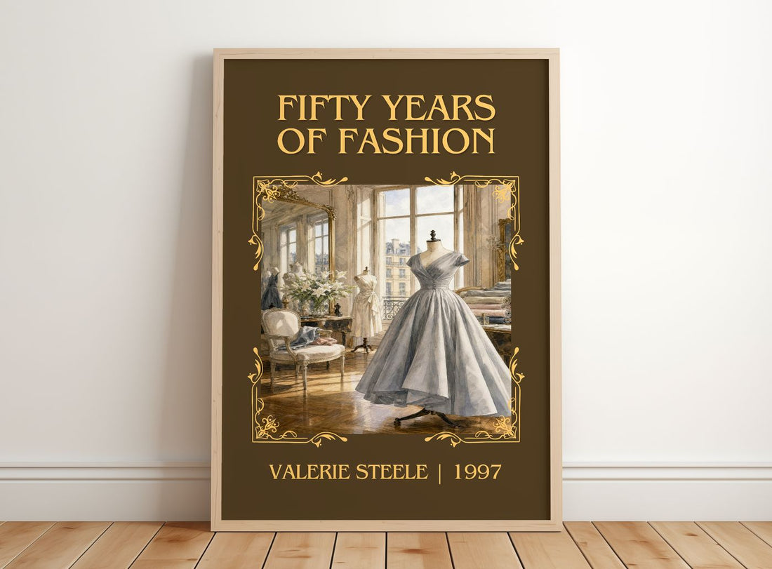 Fifty years of fashion Classic Book Art Print by Valerie Steele – framed print leaning on a wooden floor