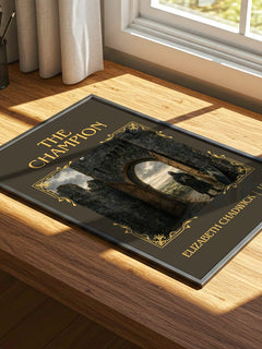 The Champion Classic Book Art Print by Elizabeth Chadwick – print on a sunlit desk