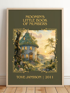 Moomin's little book of numbers Classic Book Art Print by Tove Jansson – framed print leaning on a wooden floor