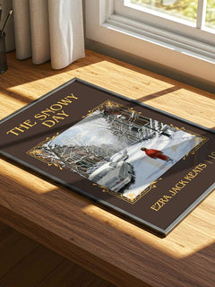 The Snowy Day Classic Book Art Print by Ezra Jack Keats – print on a sunlit desk