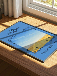 The Sheltering Sky Classic Book Art Print by Paul Bowles – print on a sunlit desk