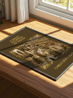 Christ Stopped at Eboli Classic Book Art Print by Carlo Levi – print on a sunlit desk