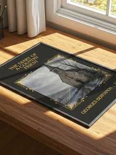 Diary of a Country Priest Classic Book Art Print by Georges Bernanos – print on a sunlit desk