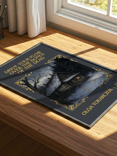 Drive Your Plow Over the Bones of the Dead Classic Book Art Print by Olga Tokarczuk – print on a sunlit desk