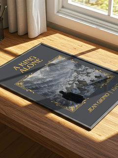 A King Alone Classic Book Art Print by Jean Giono – print on a sunlit desk