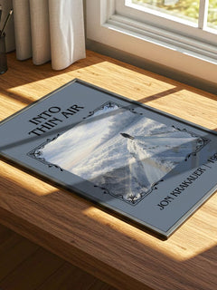 Into Thin Air Classic Book Art Print by Jon Krakauer – print on a sunlit desk