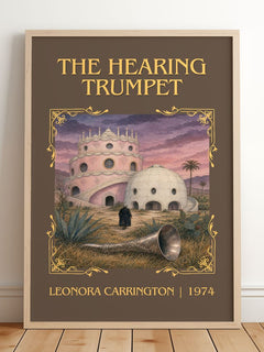 The Hearing Trumpet Classic Book Art Print by Leonora Carrington – framed print leaning on a wooden floor