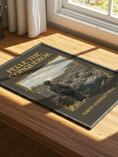 Pelle The Conqueror Classic Book Art Print by Martin Andersen Nexø – print on a sunlit desk