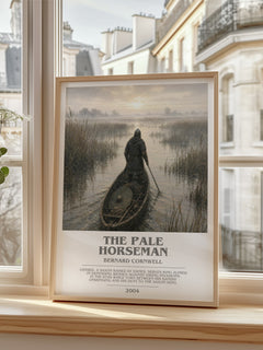The Pale Horseman Bookish Wall Art by Bernard Cornwell – framed print by a bright window