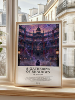 A Gathering of Shadows Bookish Wall Art by V.E. Schwab – framed print by a bright window