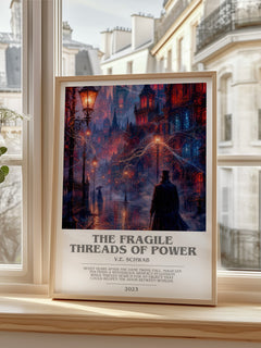 The Fragile Threads of Power Bookish Wall Art by V.E. Schwab – framed print by a bright window