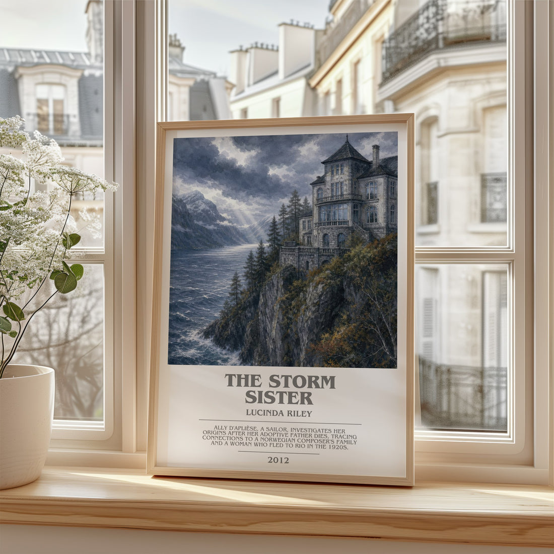 The Storm Sister Bookish Wall Art by Lucinda Riley – framed print by a bright window