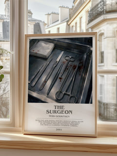 The Surgeon Bookish Wall Art by Tess Gerritsen – framed print by a bright window
