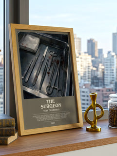 The Surgeon Bookish Wall Art by Tess Gerritsen – framed print on a city-view windowsill