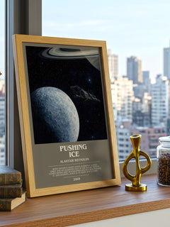Pushing Ice Bookish Wall Art by Alastair Reynolds – framed print on a city-view windowsill