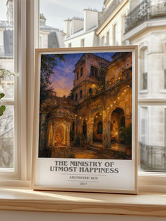 The Ministry of Utmost Happiness Book Cover Poster by Arundhati Roy – framed print by a bright window