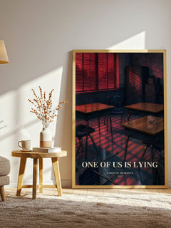 One Of Us Is Lying watercolour print in frame leaning in hallway – mystery wall art
