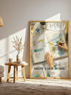 Show Your Work! watercolour print in frame leaning in hallway – non fiction wall art