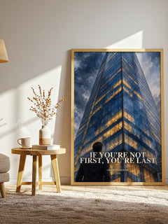 If you're not first, you're last watercolour print in frame leaning in hallway – non fiction wall art