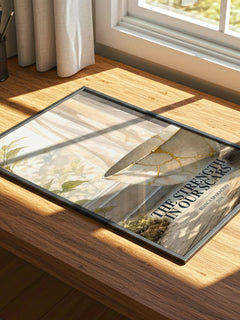 The Strength in Our Scars watercolour book poster framed on wall – poetry wall art