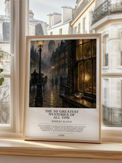 The 50 Greatest Mysteries of All Time Bookish Wall Art by Robert Bloch – framed print by a bright window