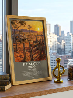 The station boss Bookish Wall Art by Jane Corrie – framed print on a city-view windowsill