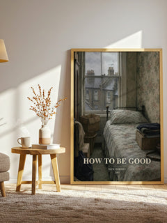 How to Be Good watercolour print in frame leaning in hallway – contemporary fiction wall art