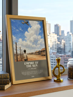 Empire of the Sun Bookish Wall Art by J. G. Ballard – framed print on a city-view windowsill