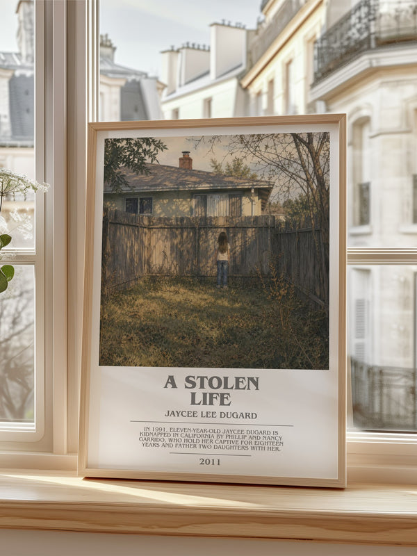 A Stolen Life Bookish Wall Art by Jaycee Lee Dugard – framed print by a bright window