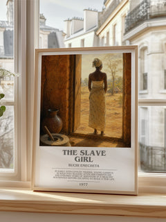 The slave girl Bookish Wall Art by Buchi Emecheta – framed print by a bright window