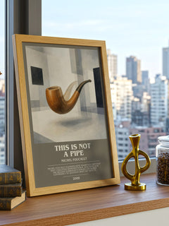 This Is Not a Pipe Bookish Wall Art by Michel Foucault – framed print on a city-view windowsill