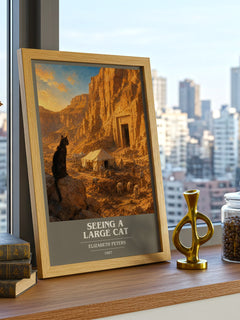 Seeing a large cat book cover print framed by window – literary home decor