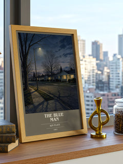 The blue man book cover print framed by window – literary home decor